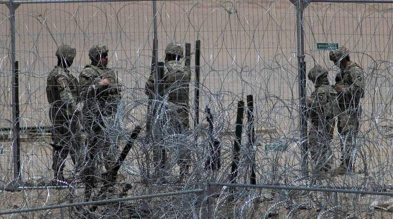 migrantes Texas guardias balas goma