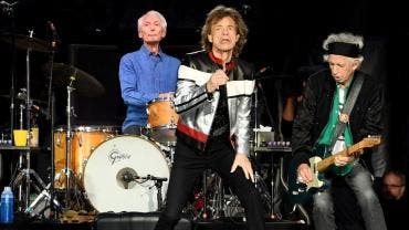 Charlie Watts con Mick Jagger y Keith Richards, integrantes de The Rolling Stones.