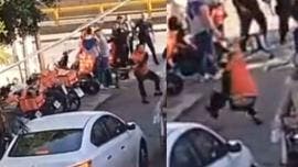 (video) Repartidores de aplicación golpean a policías en Río San Joaquín